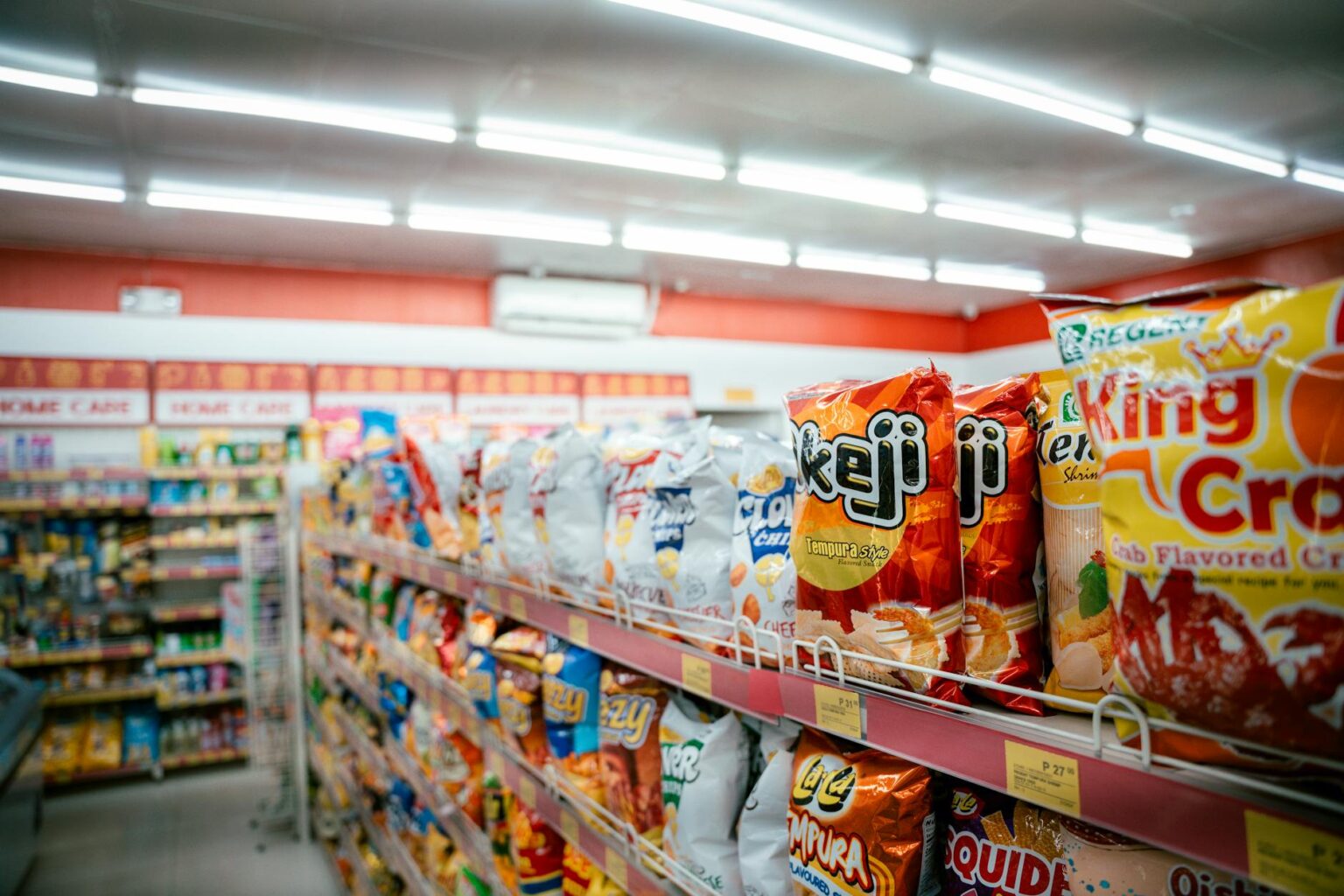 Modern grocery store interior with wide aisles and product displays