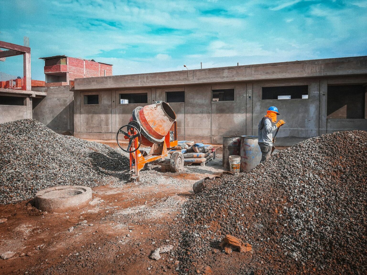 The Economic Impact of America’s Skilled Trades Worker Shortage Construction worker in hard hat and safety vest working on building site