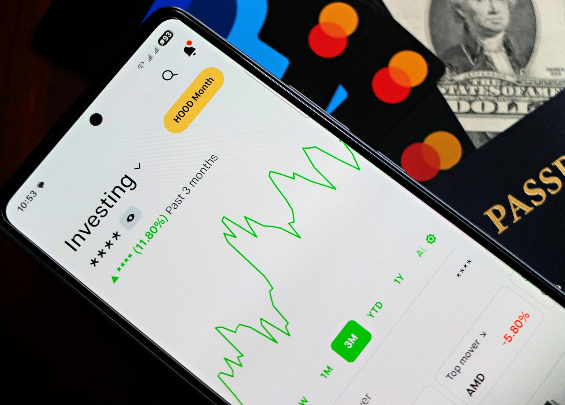 Person using smartphone to check financial investment app interface