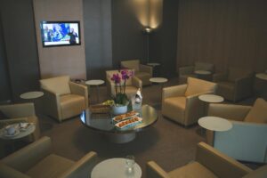 Modern airport lounge interior with comfortable seating and business amenities