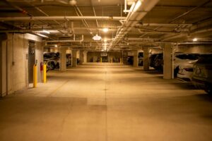 How Major Department Stores Are Monetizing Their Parking Structures Multi-level parking garage interior with concrete structure and lighting