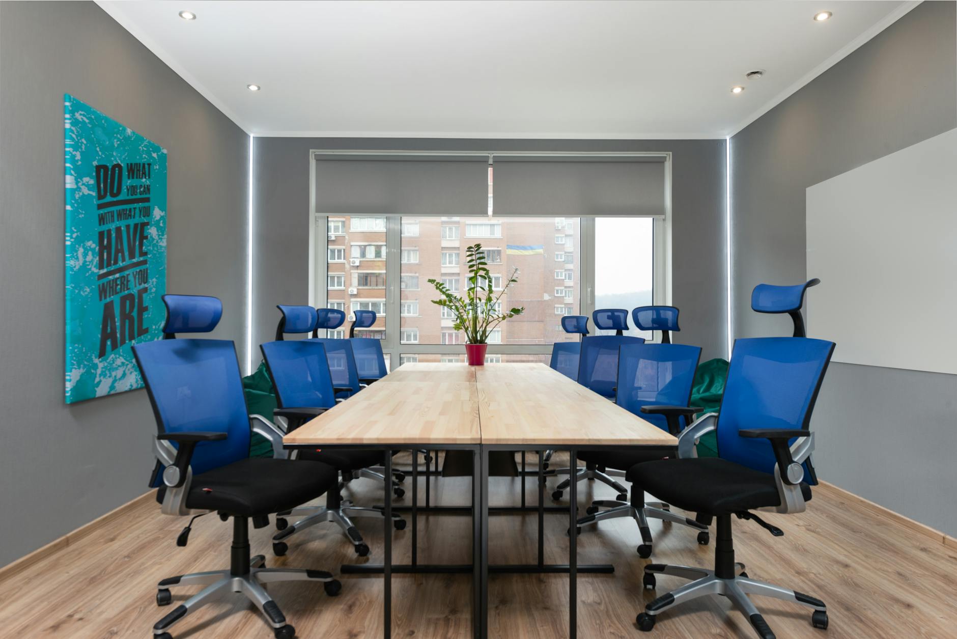 Modern office meeting room with conference table and chairs