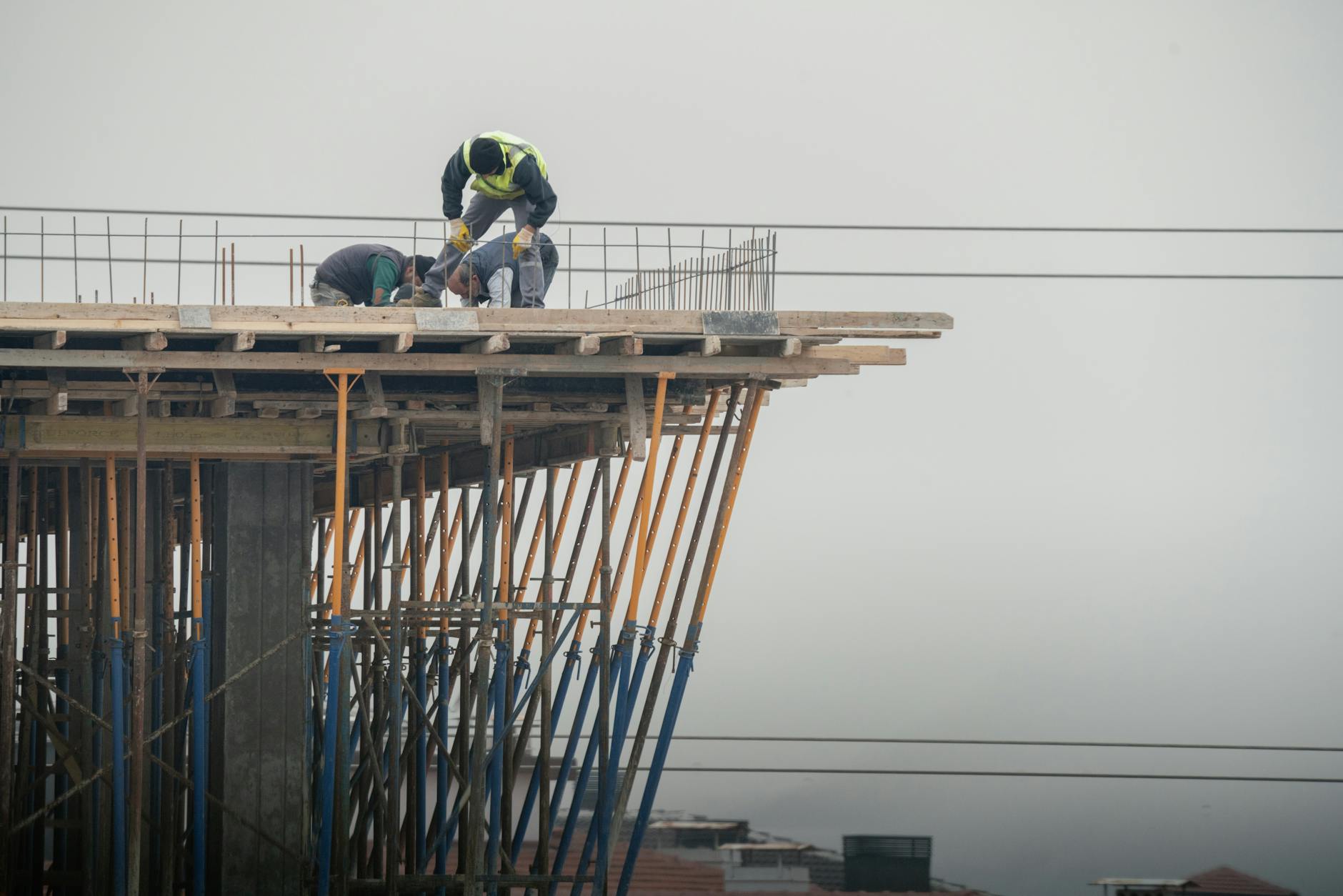 Construction workers in hard hats working on infrastructure project