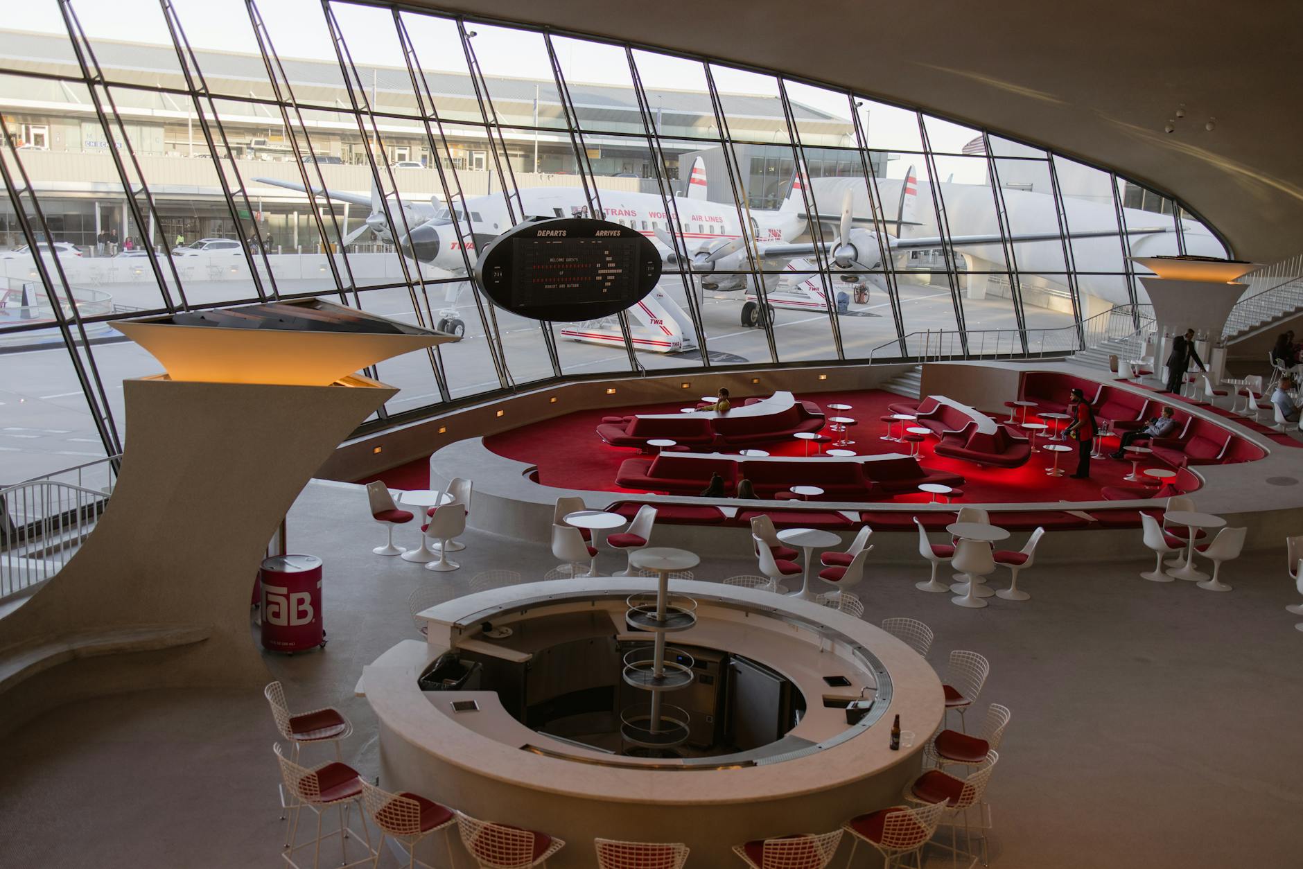 Modern airport lounge interior with comfortable seating and panoramic windows