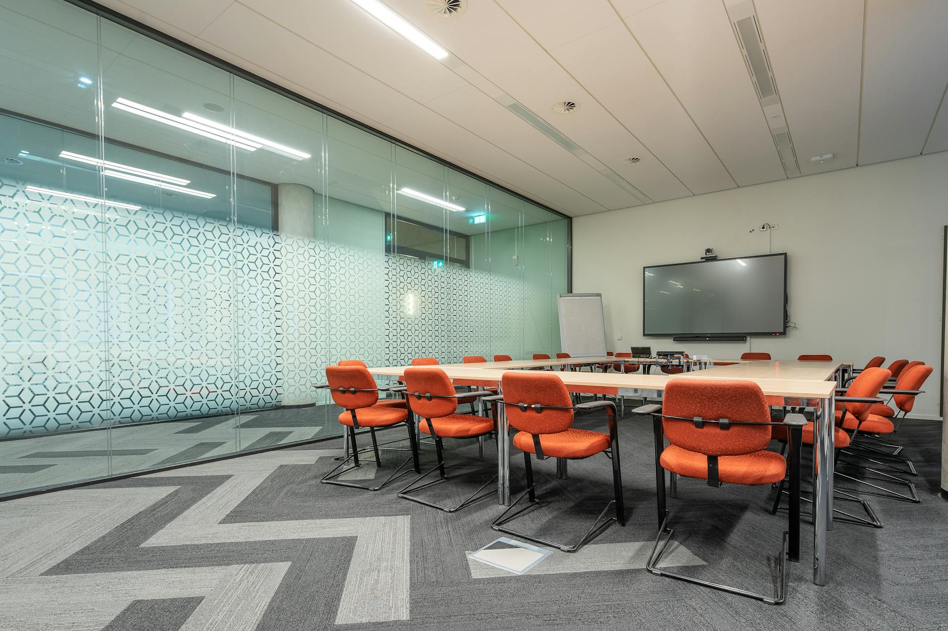 Empty modern conference room with chairs arranged around table
