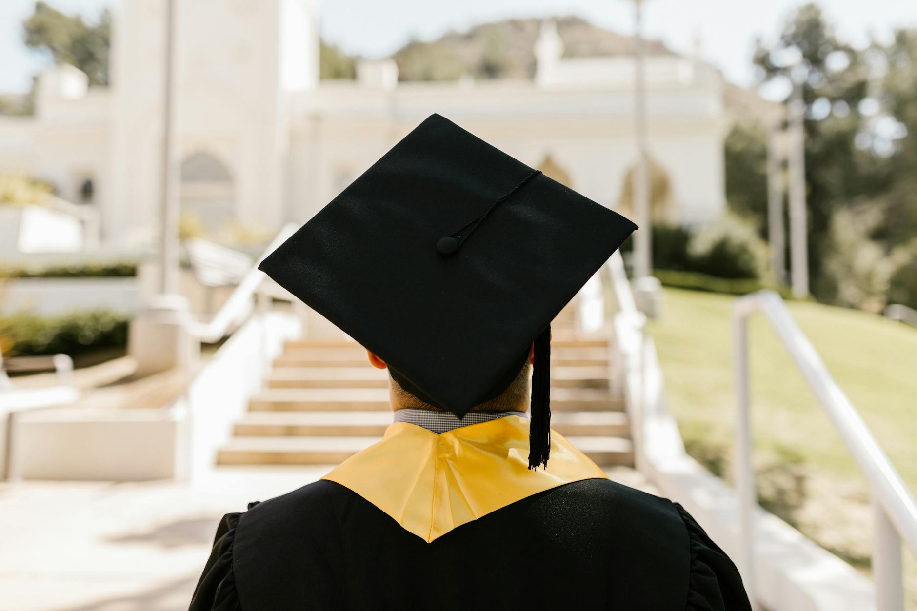 Graduation cap and diploma symbolizing education expenses and student loan repayment strategies