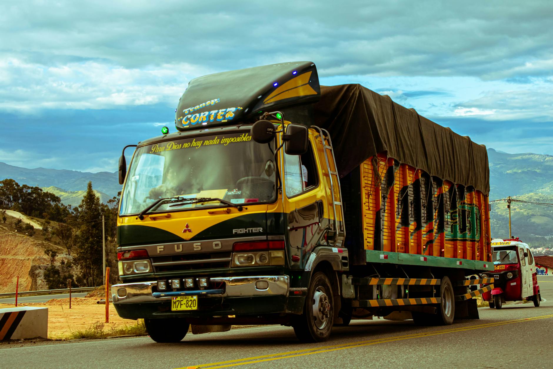 Commercial delivery trucks being loaded at a distribution facility