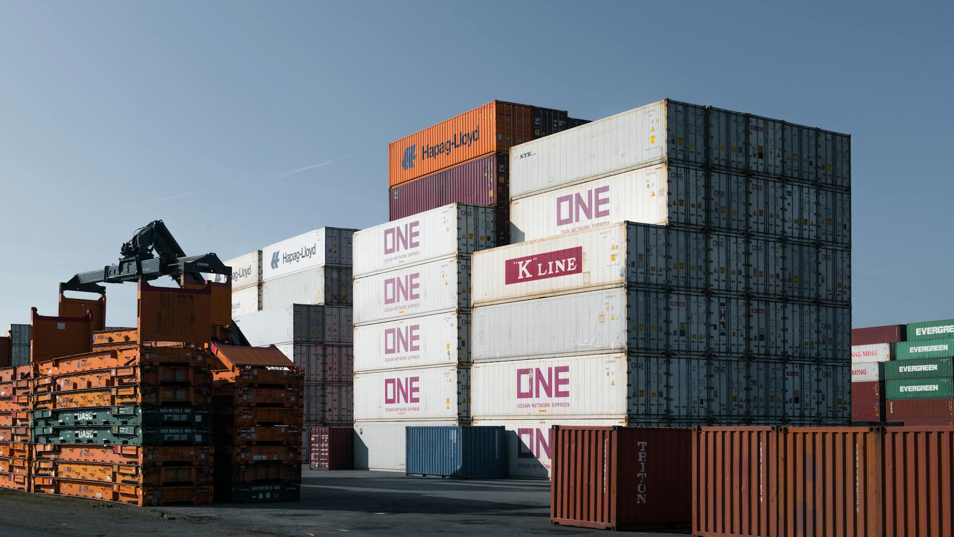 Cargo containers stacked at shipping port terminal