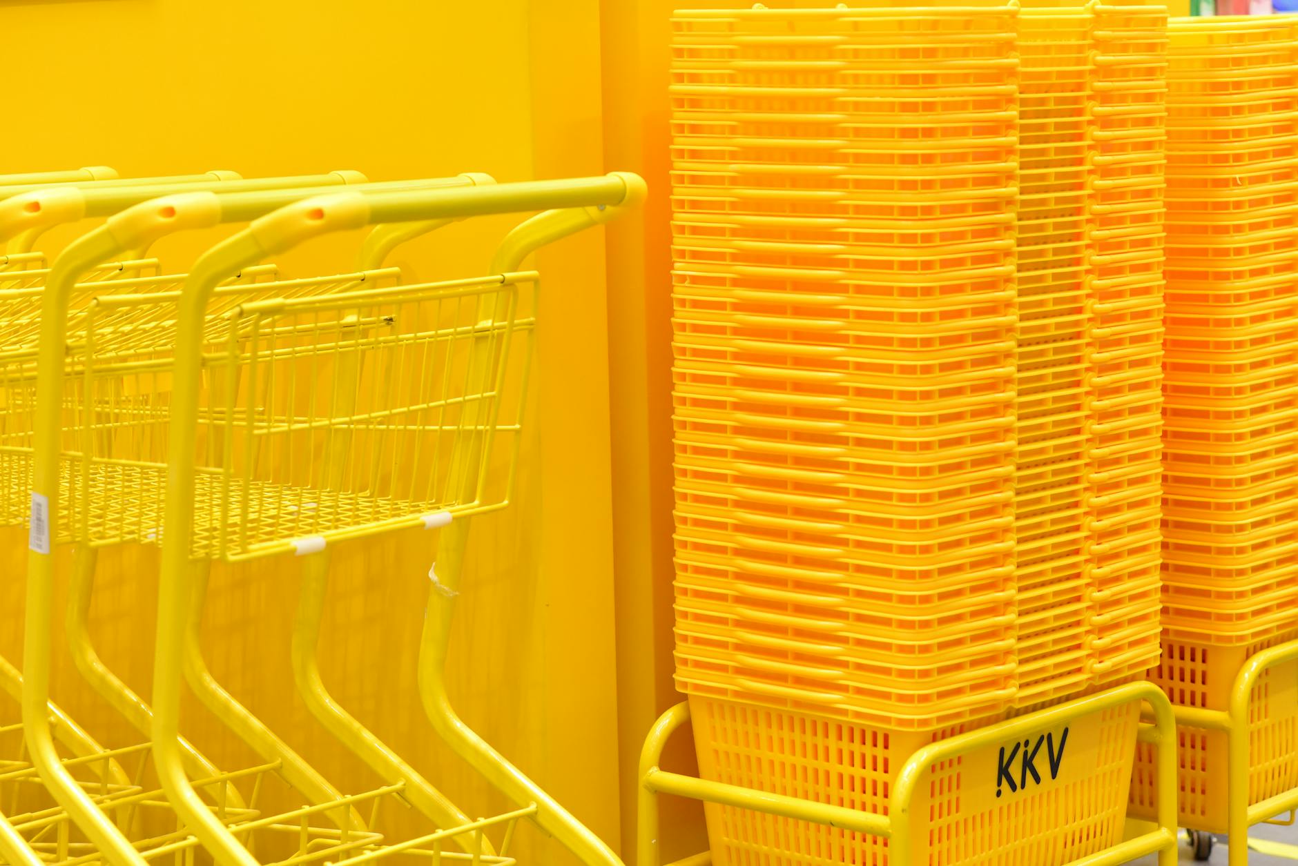 Shopping cart filled with various grocery items and products