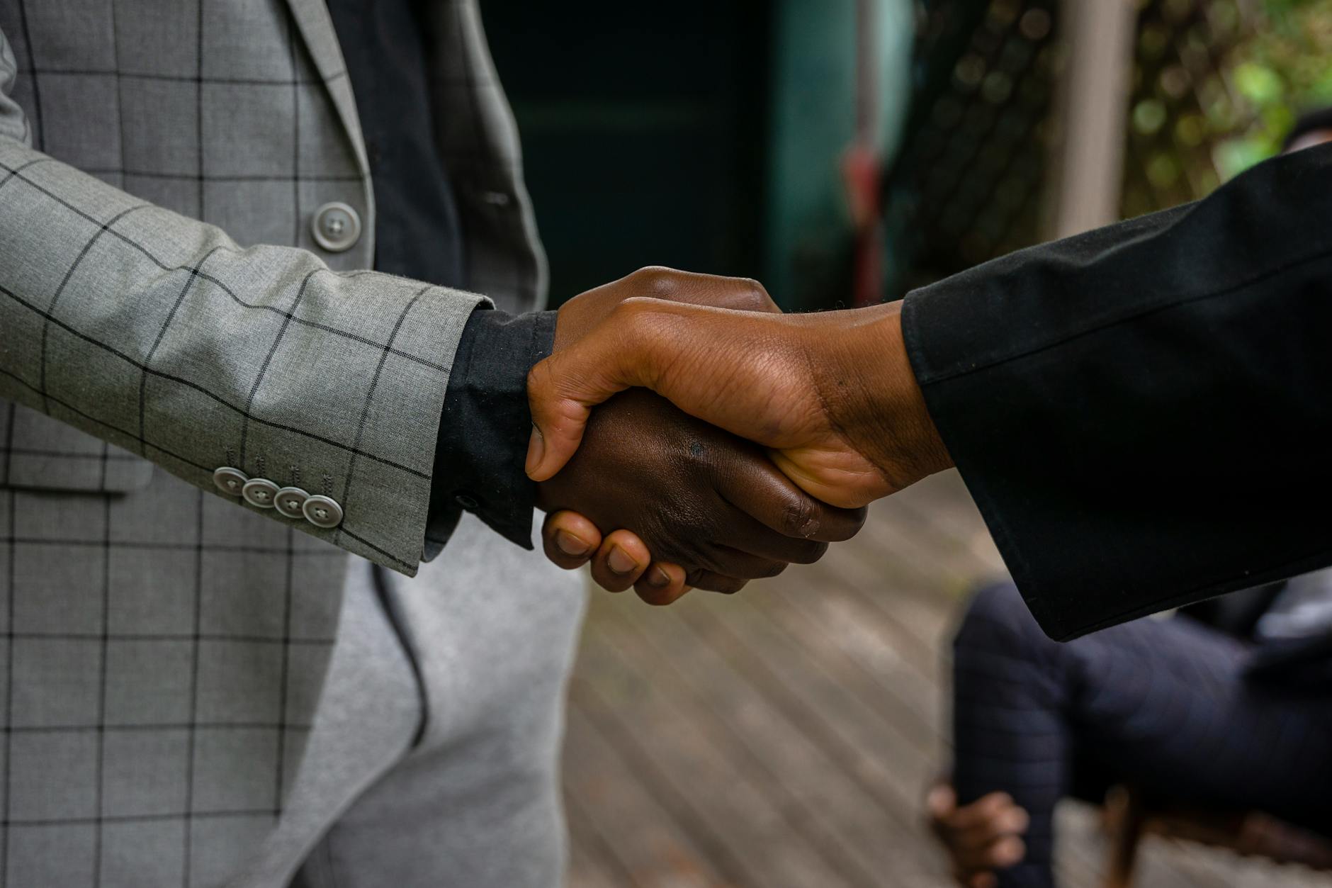 Business handshake representing successful real estate transaction