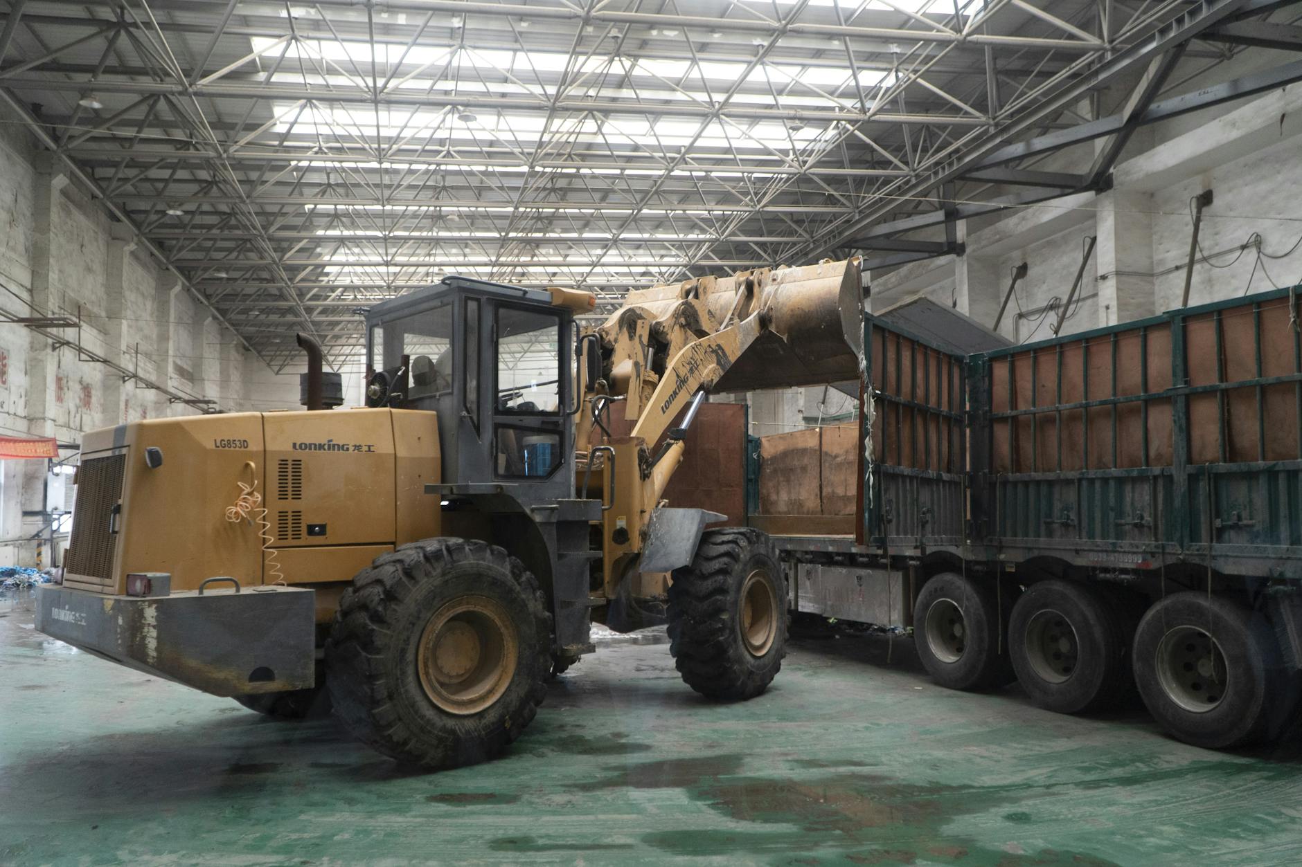Warehouse loading dock with trucks showing freight distribution operations