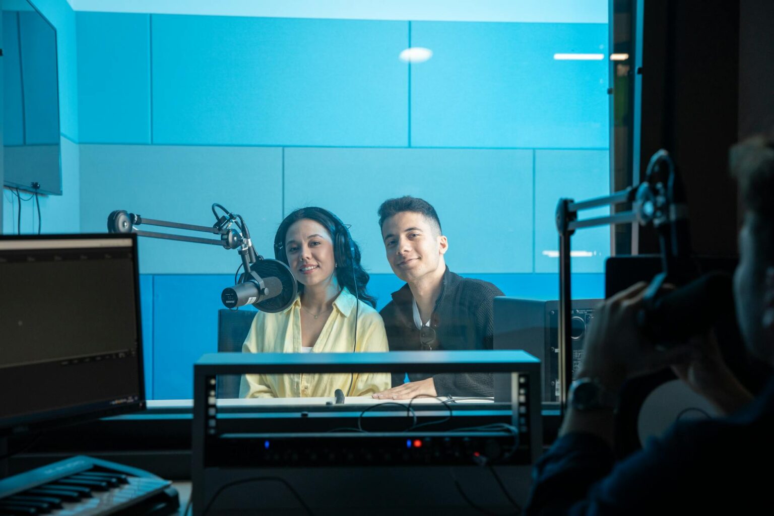 IHeartMedia and Sirius XM Explore Audio Empire Merger Professional radio microphone in broadcast studio