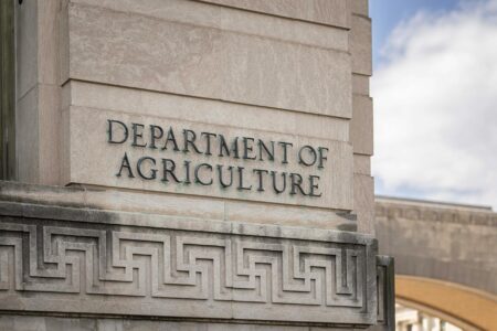 Federal government building representing Justice Department oversight