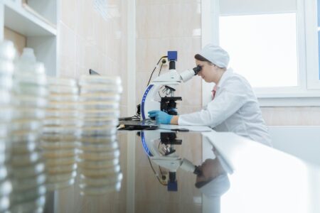 Scientists conducting pharmaceutical research in modern laboratory setting