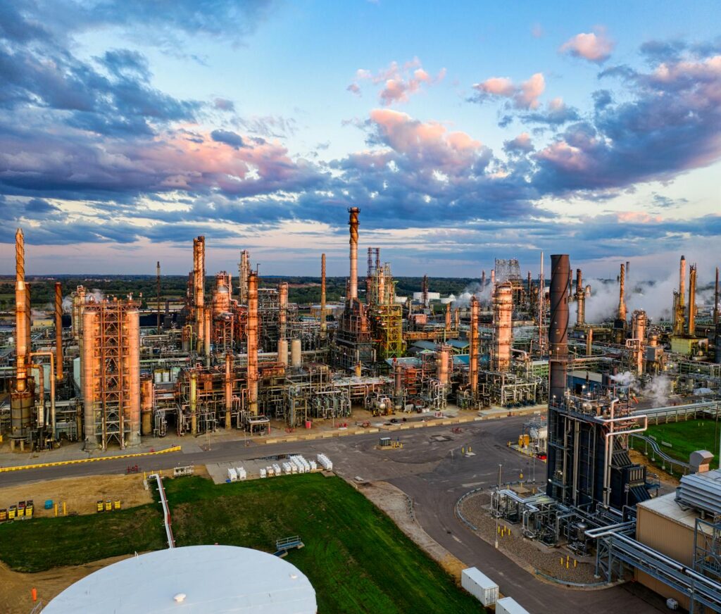 Industrial oil refinery facility with storage tanks and processing equipment