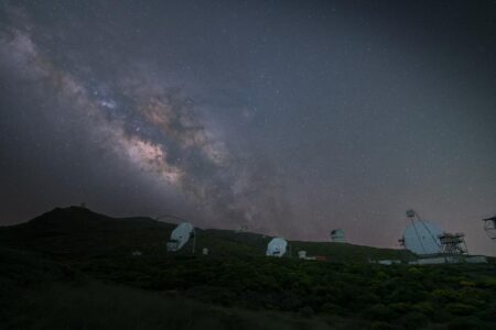 Large telescope in observatory dome pointing toward night sky