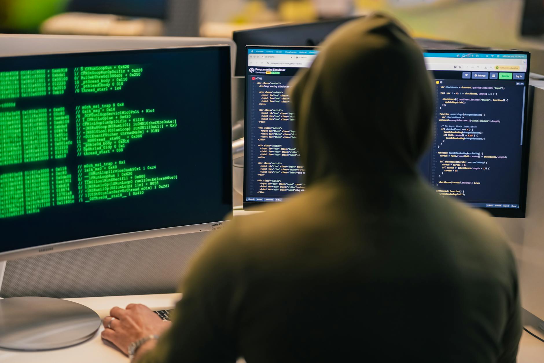 Computer screens displaying cybersecurity threat monitoring systems