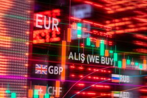 Multiple international currency notes arranged on trading desk