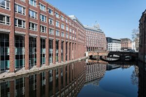 City canal with water flowing through urban environment