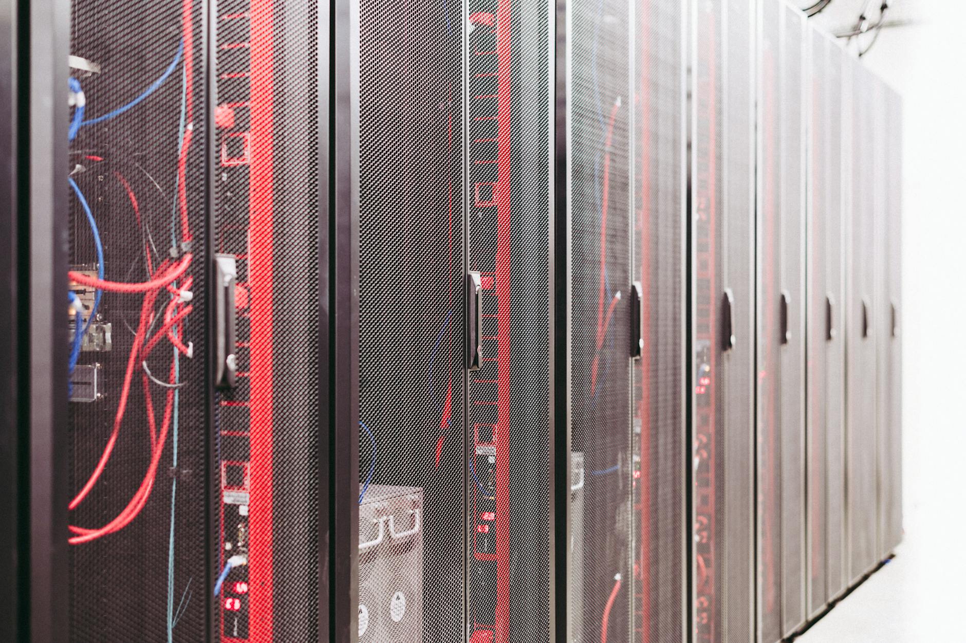 Rows of servers in modern data center facility with blue lighting