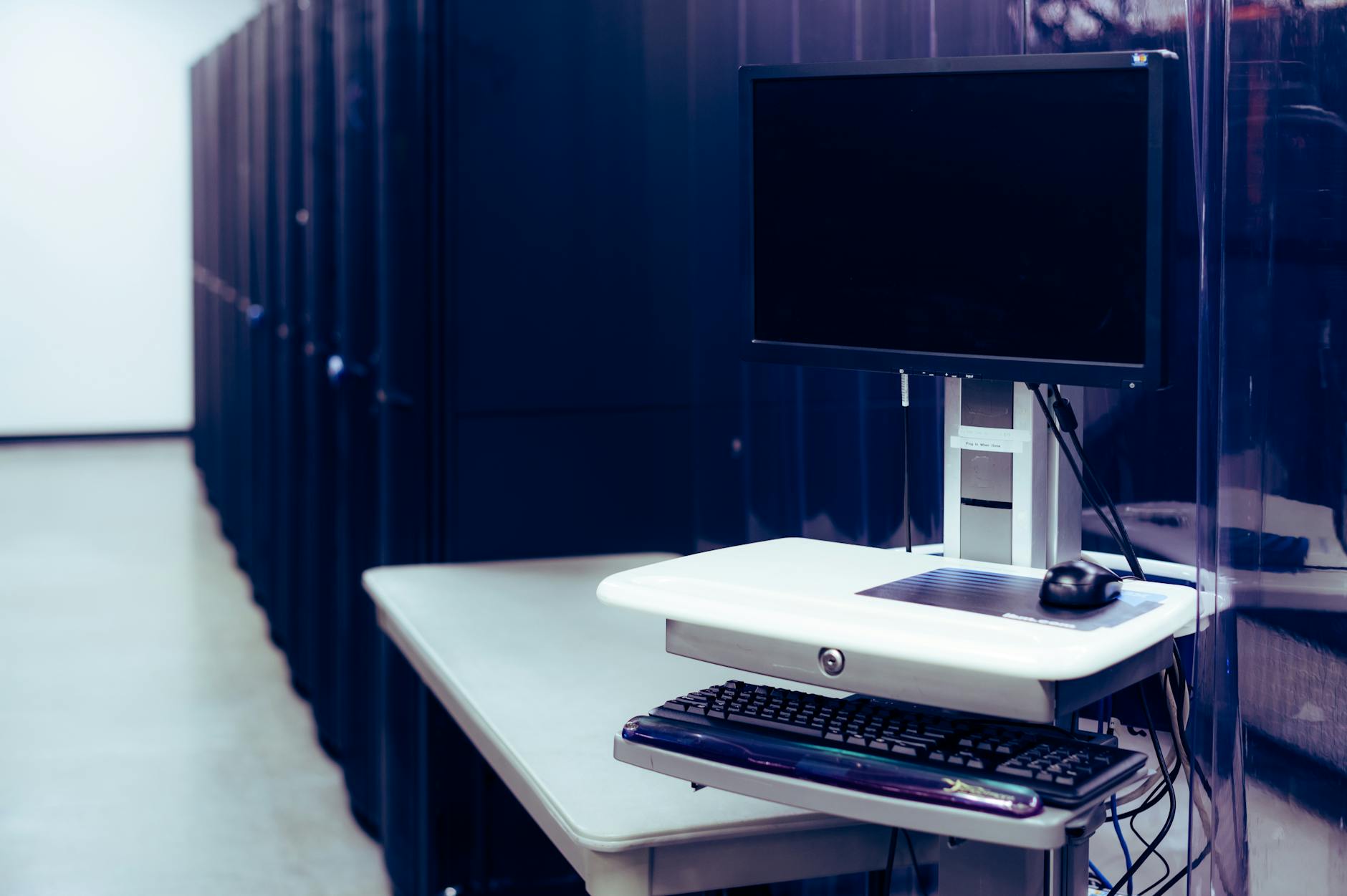 Rows of servers in modern data center facility