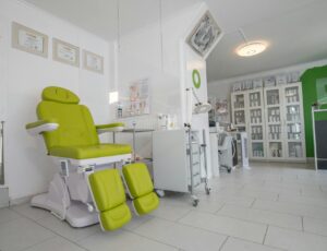 Modern medical clinic waiting room with chairs and reception desk