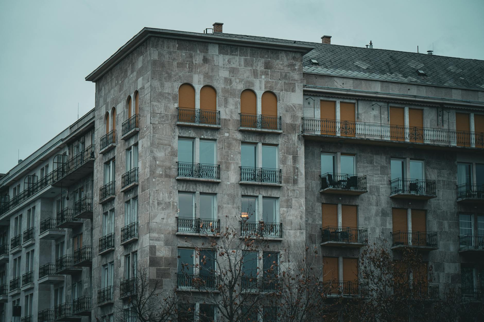Multi-story residential apartment building exterior showing typical middle market property investment