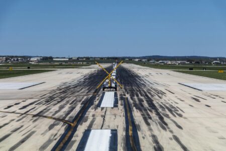 Commercial aircraft on airport runway during landing approach