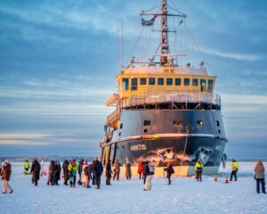 Expedition cruise ship navigating through icy polar waters