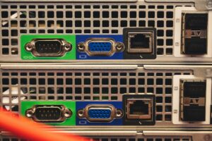 Rows of servers in a modern data center facility with blue lighting