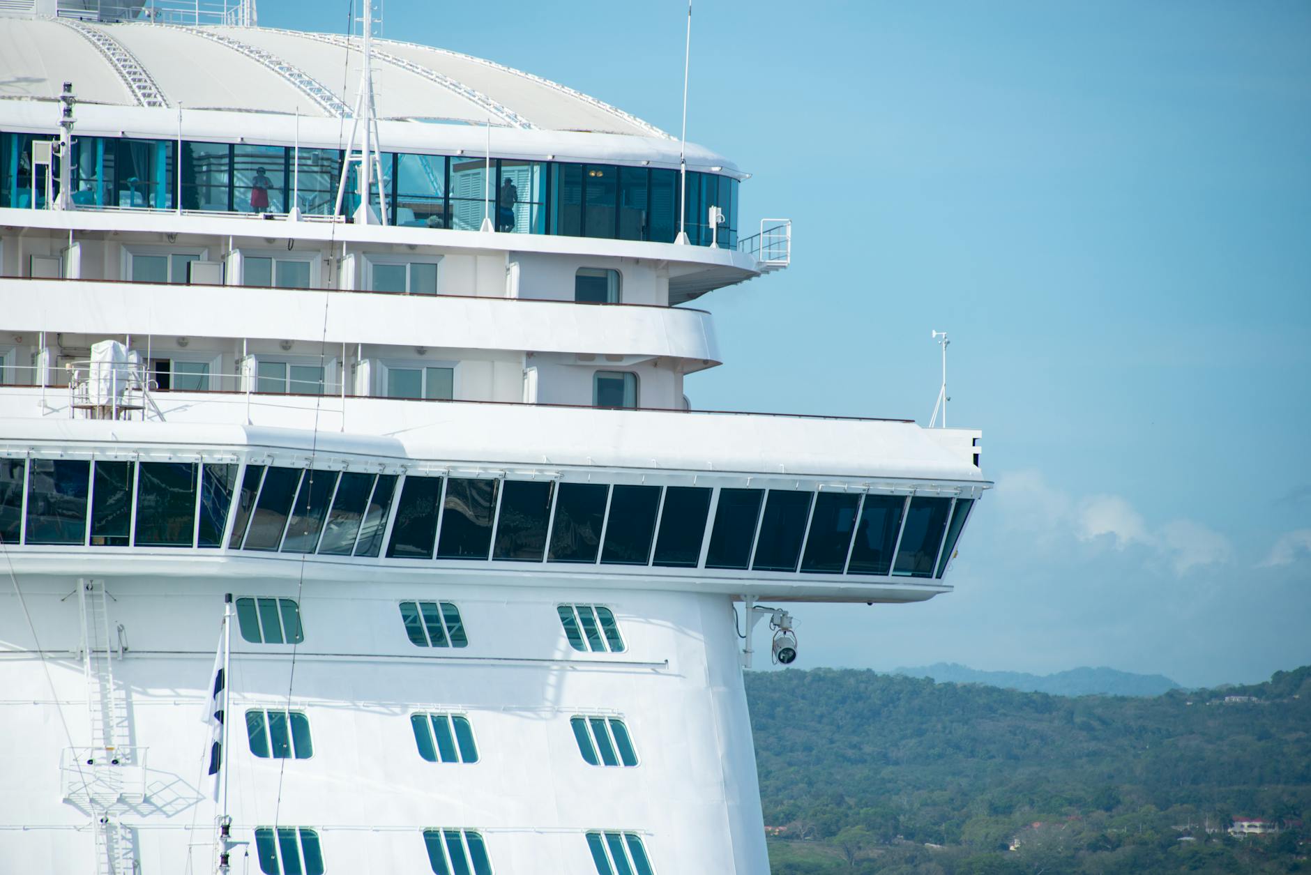 Large cruise ship sailing through ocean waters