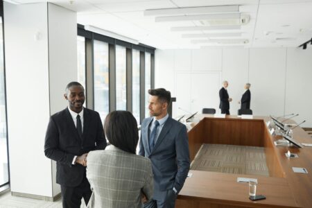 Business executives in formal meeting discussing corporate matters