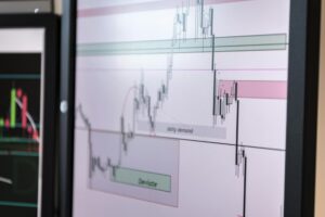 Digital trading charts showing cryptocurrency price movements and market data