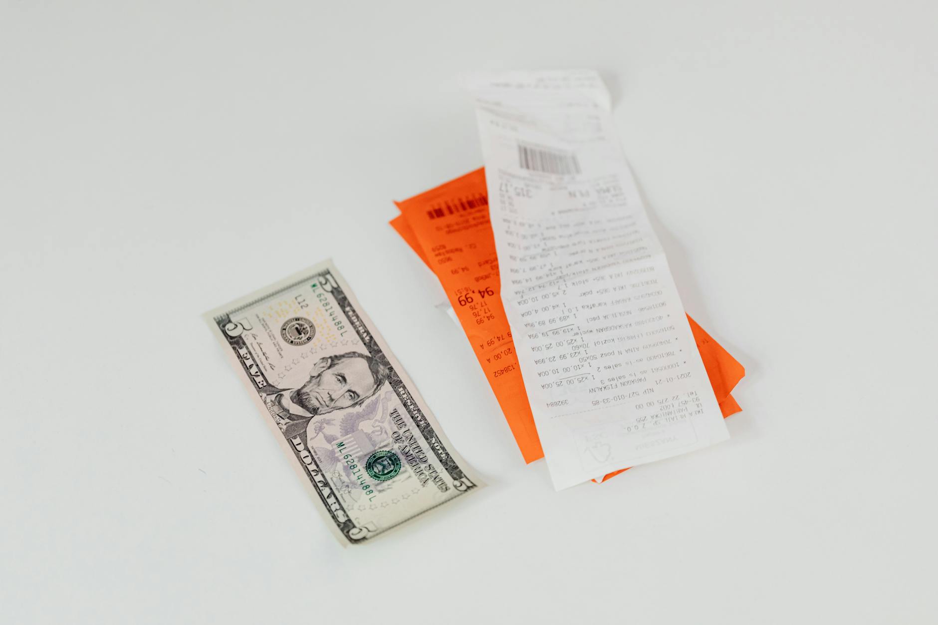 Consumer examining grocery receipt showing rising food prices
