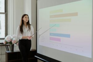 Business charts and financial graphs on presentation screen