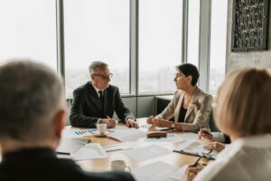 Corporate shareholders meeting with attendees voting on company proposals
