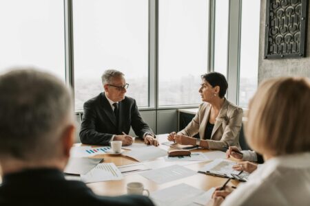Corporate shareholders meeting with attendees voting on company proposals