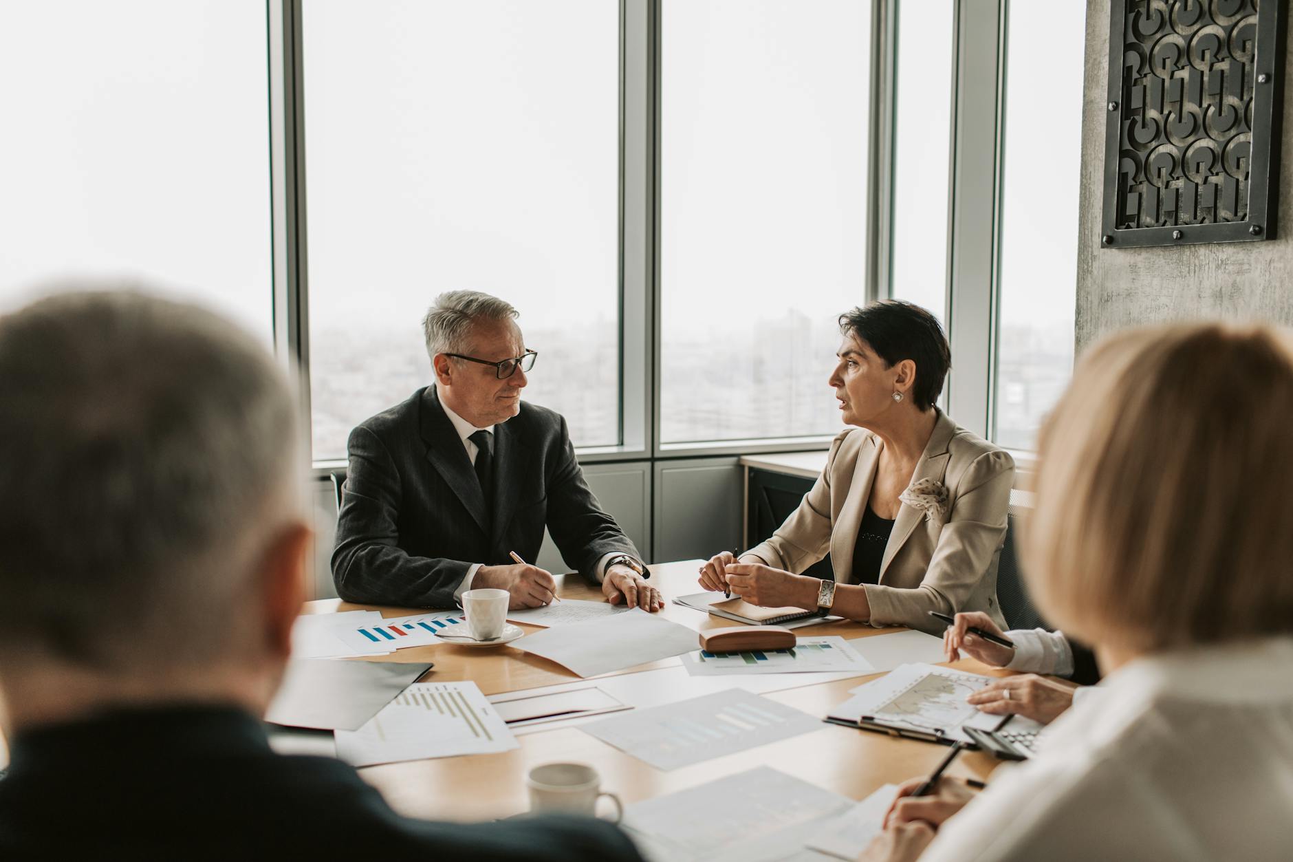 Corporate shareholders meeting with attendees voting on company proposals