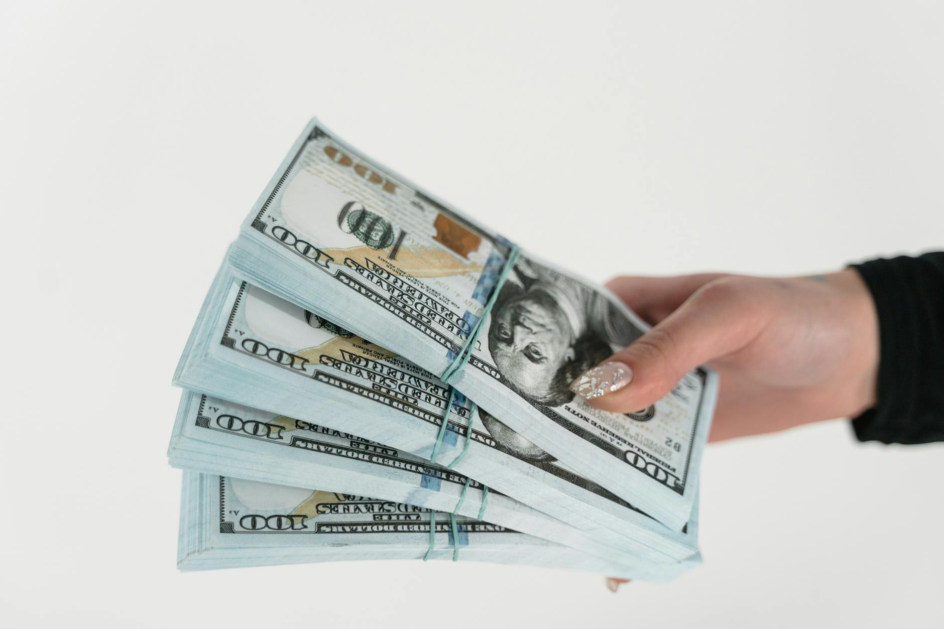Stack of money representing Netflix's massive content investment spending