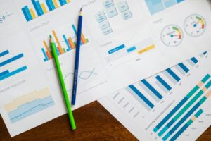 Financial charts and planning documents showing investment analysis