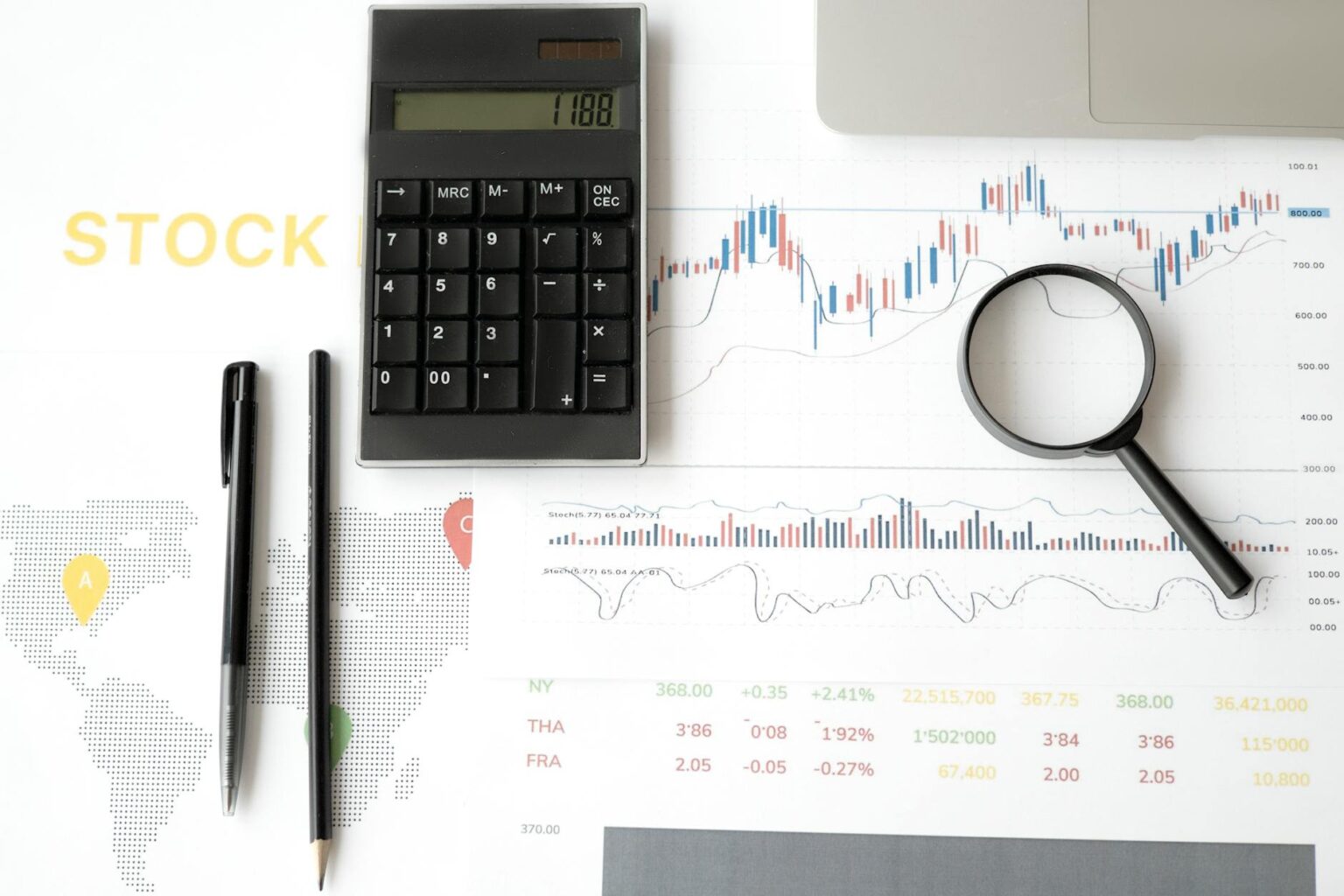 Financial analyst reviewing stock market charts and technical patterns