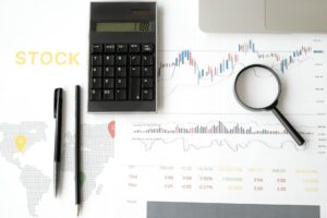 Financial analyst reviewing stock market charts and technical patterns