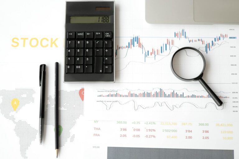 Financial analyst reviewing stock market charts and technical patterns