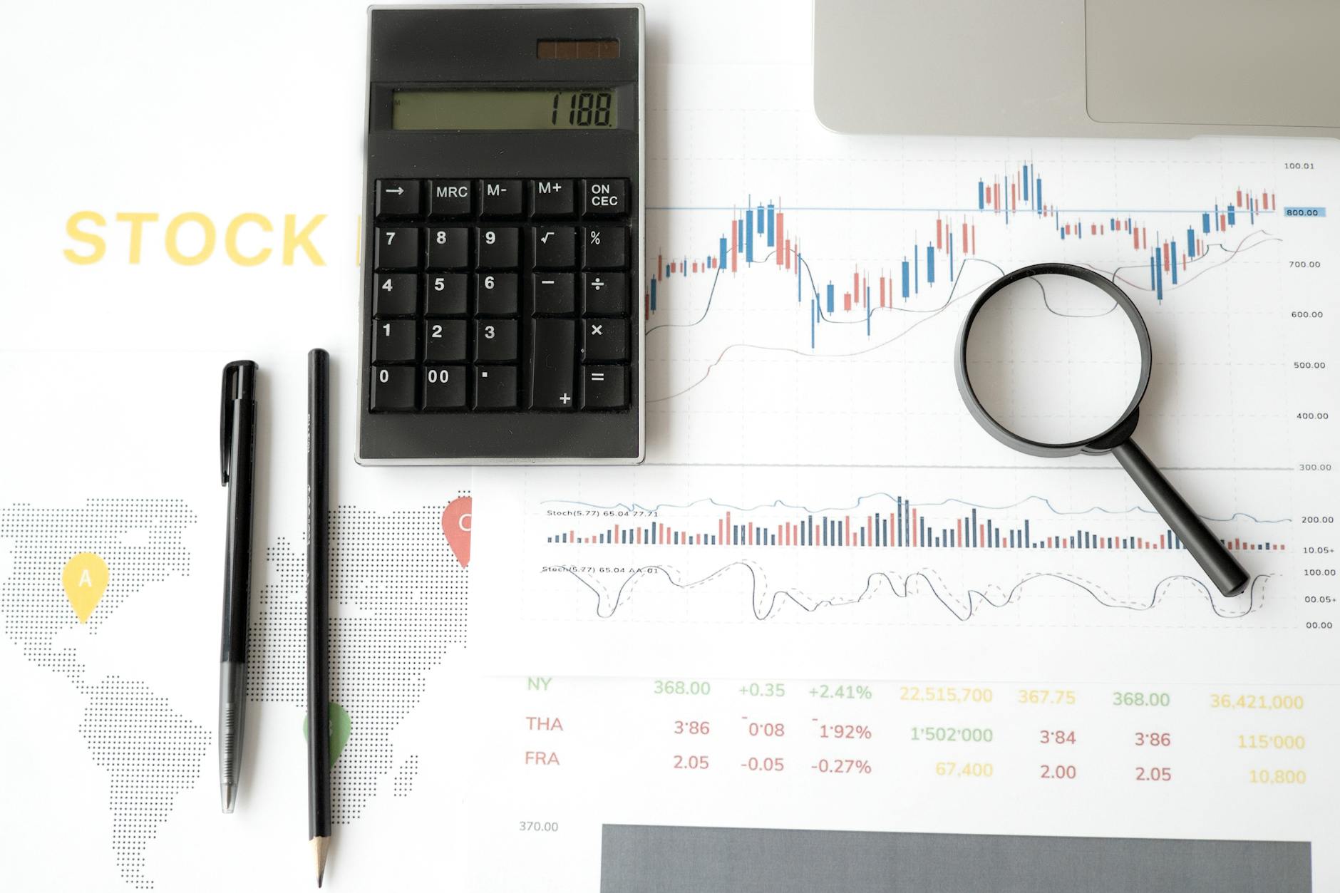 Financial analyst reviewing stock market charts and technical patterns