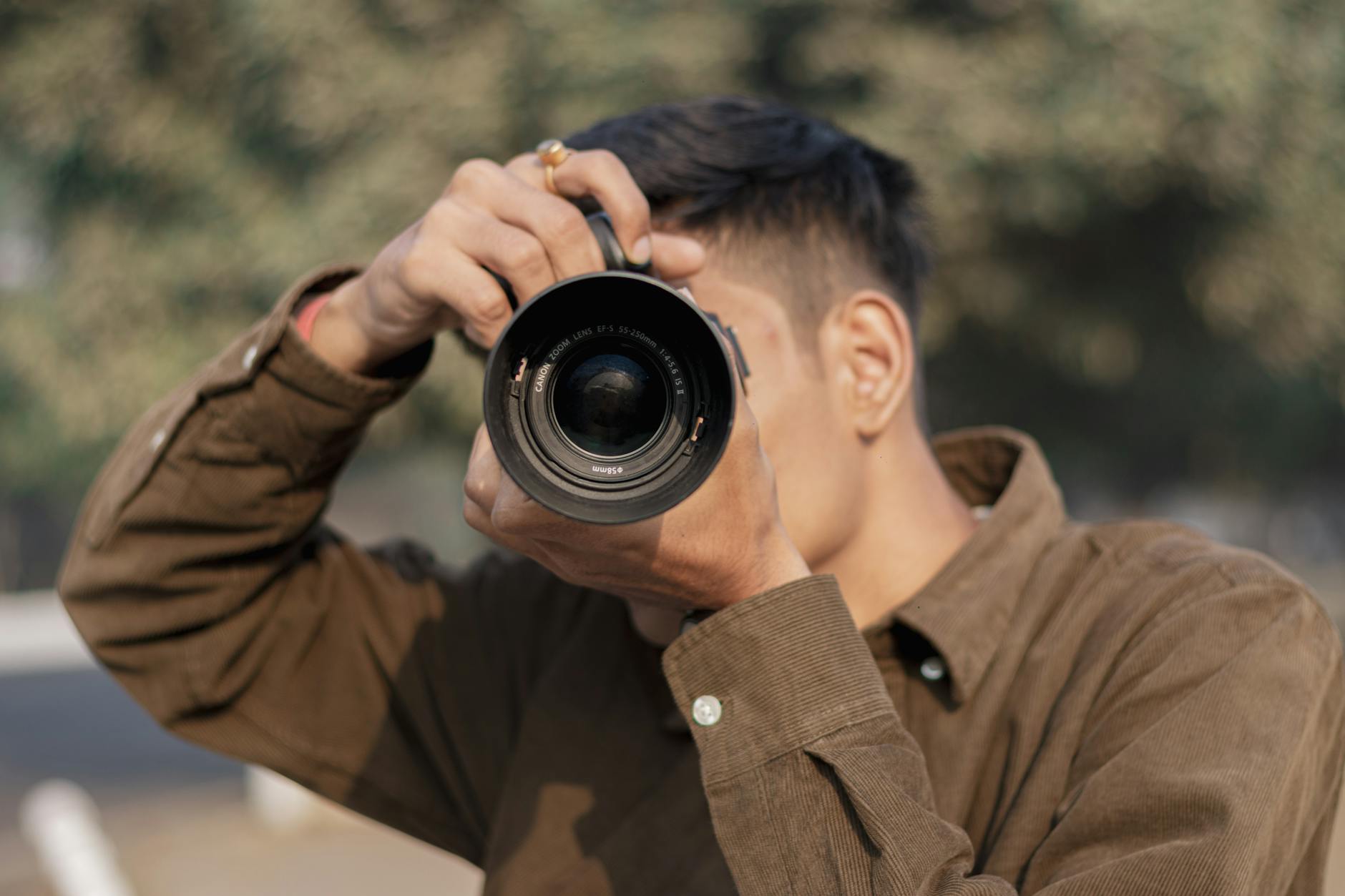 Professional photographer with camera equipment at media event