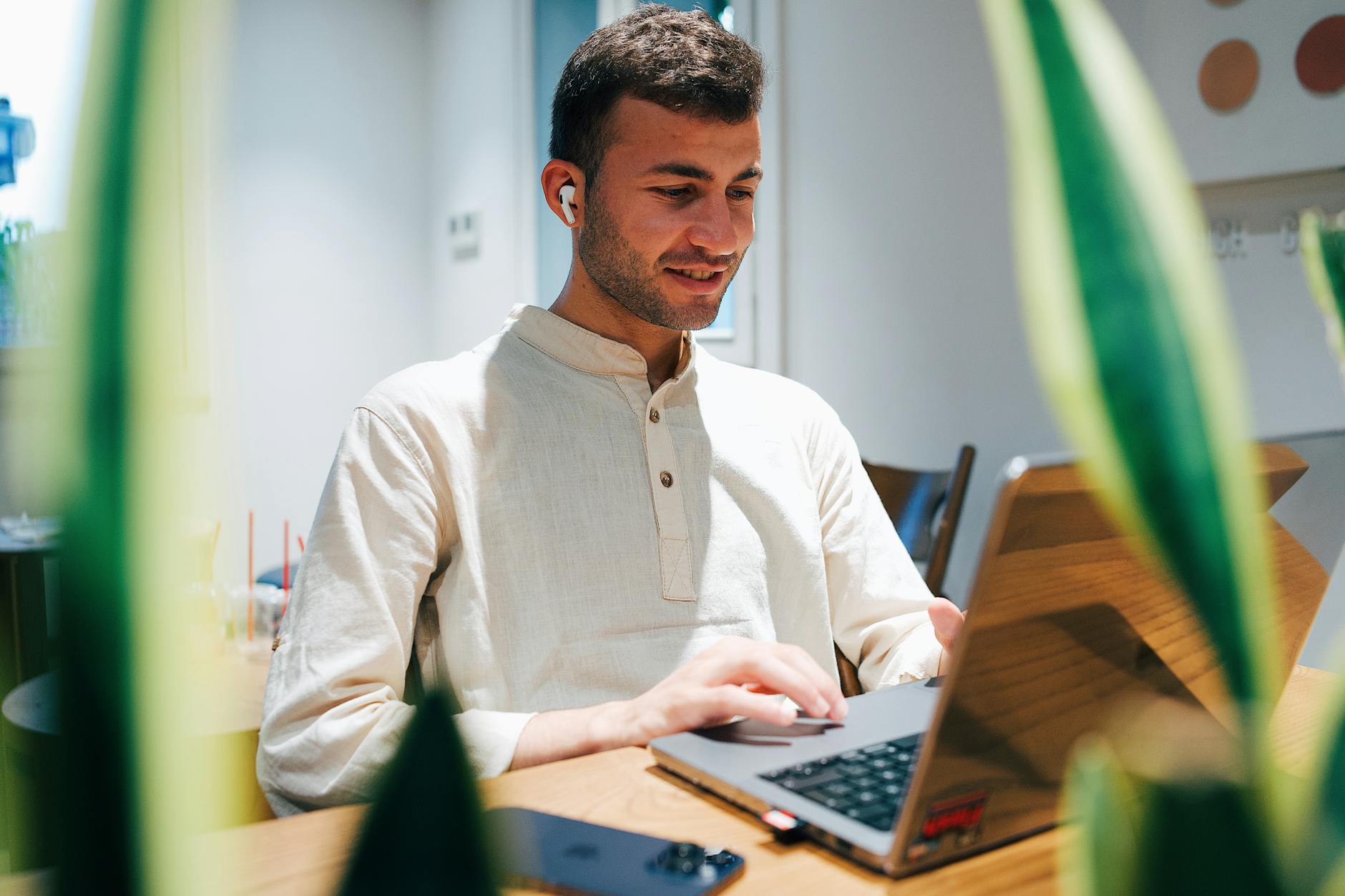Young professional working at desk with financial documents and calculator