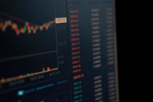 Trader watching stock market futures on digital screen showing declining numbers