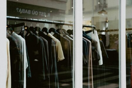 Interior of a clothing retail store with apparel displayed on racks