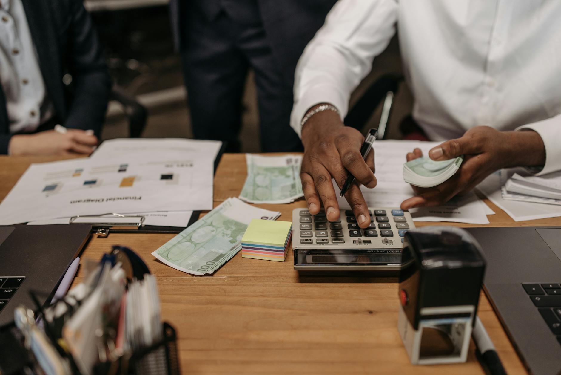 Calculator and money representing savings account calculations