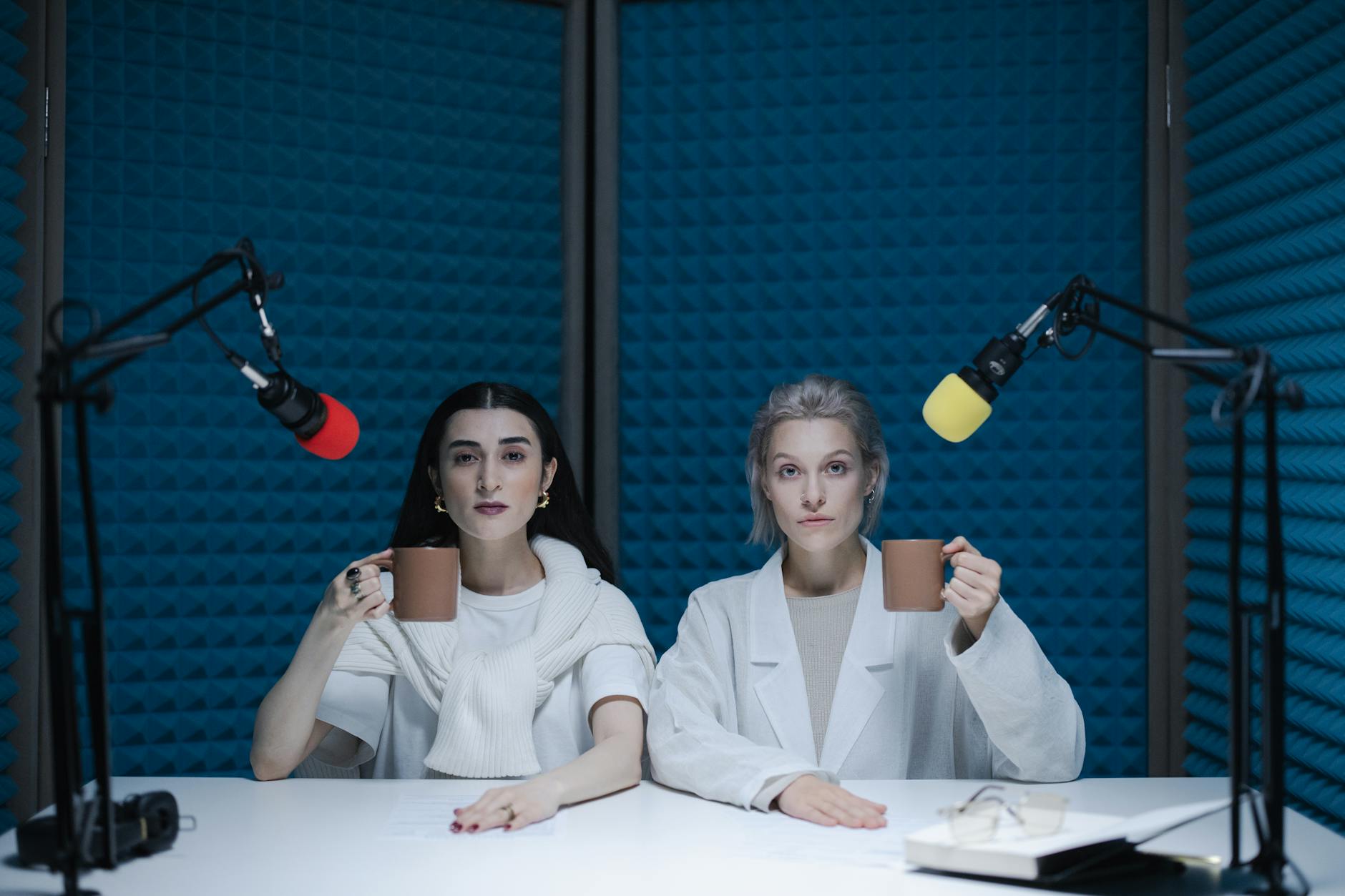 Professional television news studio with cameras and broadcasting equipment